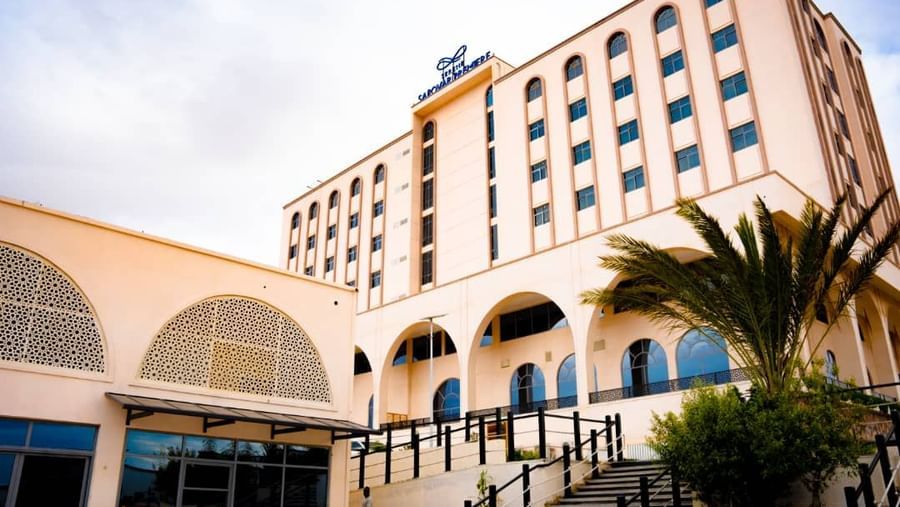 Side-angle capture of a hotel in Hargeisa with arched entrance - Serene Sarovar Premiere Hargeisa