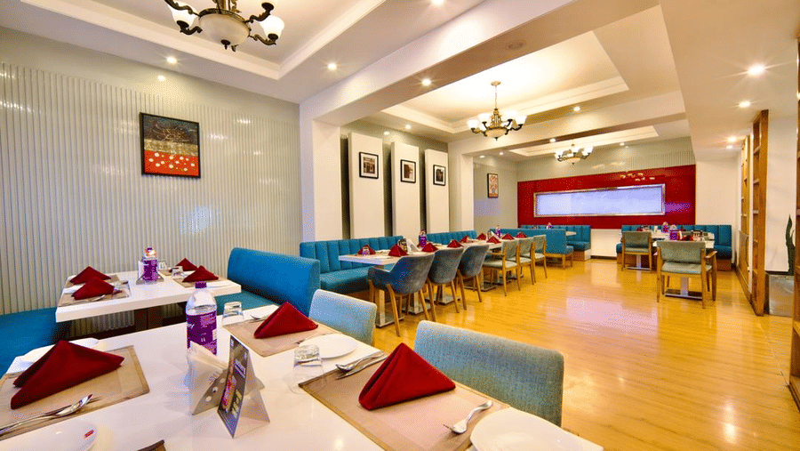 Dining area of Lords Plaza Ankleshwar with comfortable seating and modern interiors