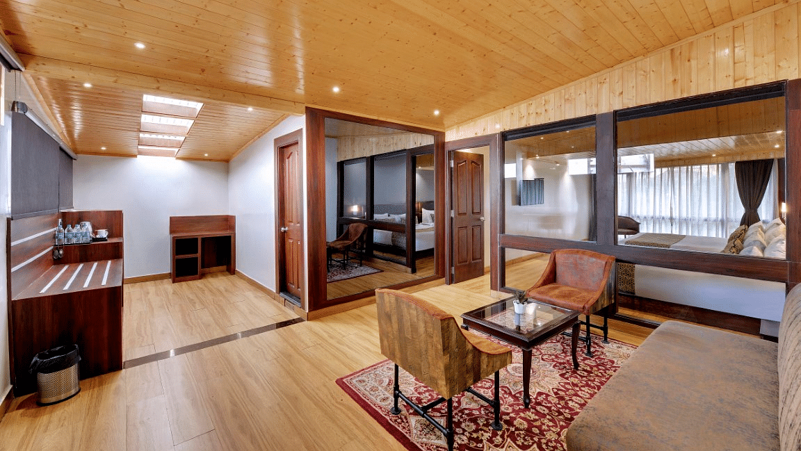 An image of a room with sofa sets, centre table and minimal decoration - Sumitel Vista TV Tower