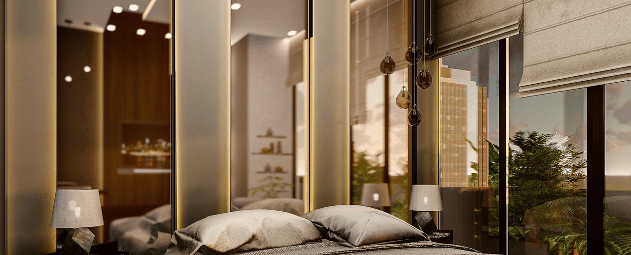 A luxurious bedroom featuring a double bed with few pillows kept over it.