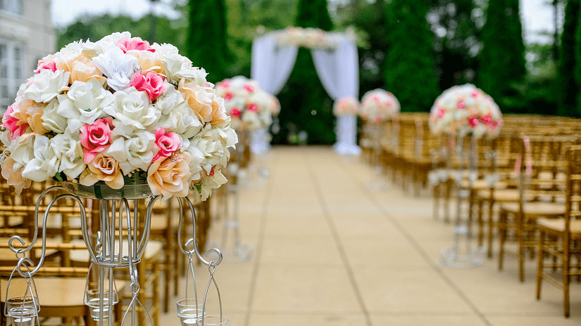 a view of a seating arrangements with pathway for the bride to walk