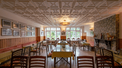 Restaurant seating with stylish interiors at Himalaya Hotel, Nainital