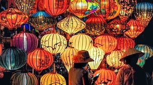 two-person-standing-near-assorted-color-paper-lanterns-1313814