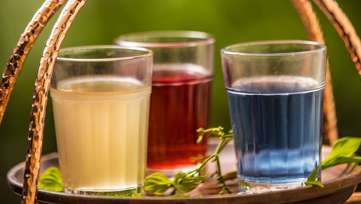 Image of different glasses with drinks kept in a basket - GReaT trails Wayanad by GRT Hotels.