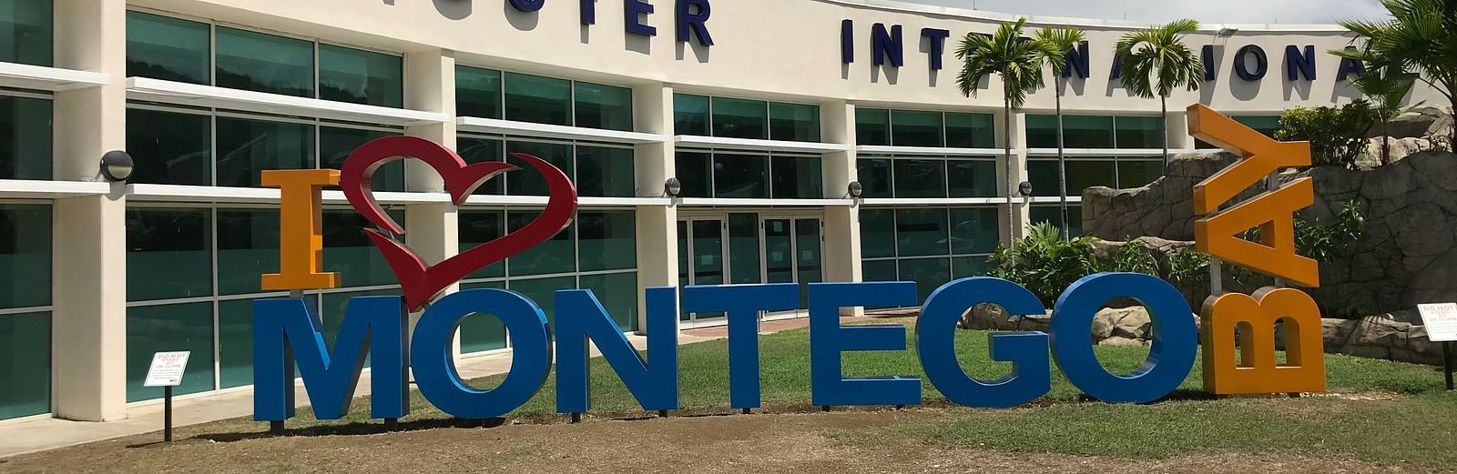 An image of Sangster International Airport with a signage that reads I love Montego Bay - Hotel 39, Jamaica