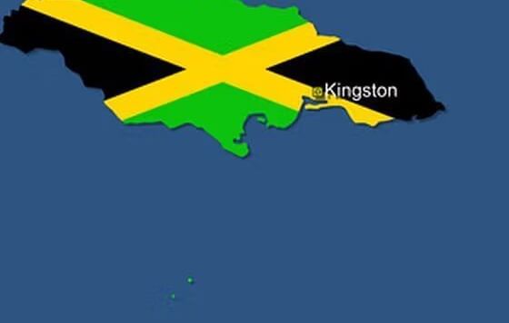 The green, yellow, and black Jamaican flag is superimposed on a stylized map outline of Jamaica against a blue background.