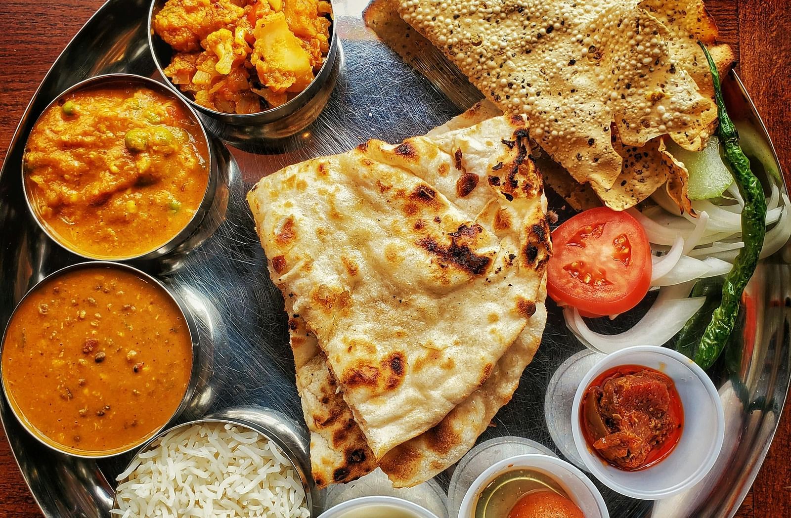 Top view of a plate filled with a variety of food.