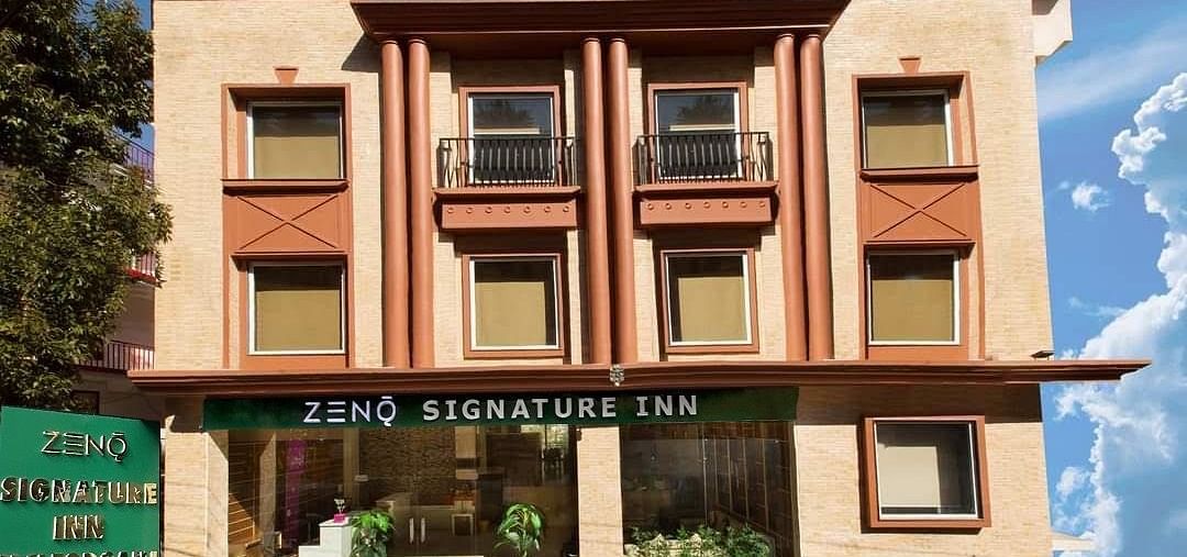 facade image of the ZENQ SIGNATURE INN, MCLEODGANJ with a beutiful blue sky in the background