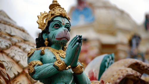 An idol of Lord Hanuman under a clear sky