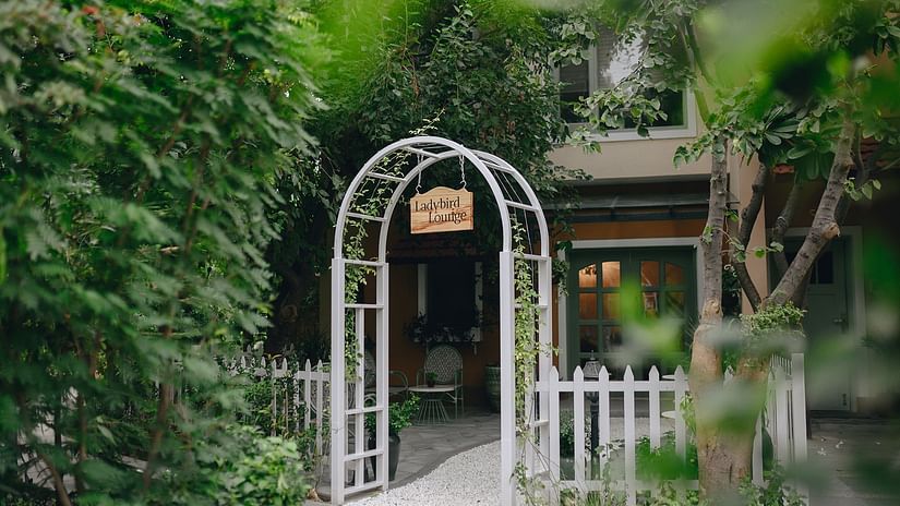 An overview of the entrance of Chalet with a arch and gate in view - Karma Lakelands.