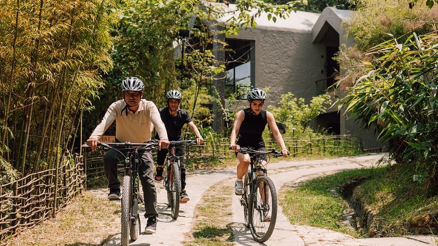 Front view of three young boys cycling in a pavement | Kavya Resort and Spa, Nagarkot