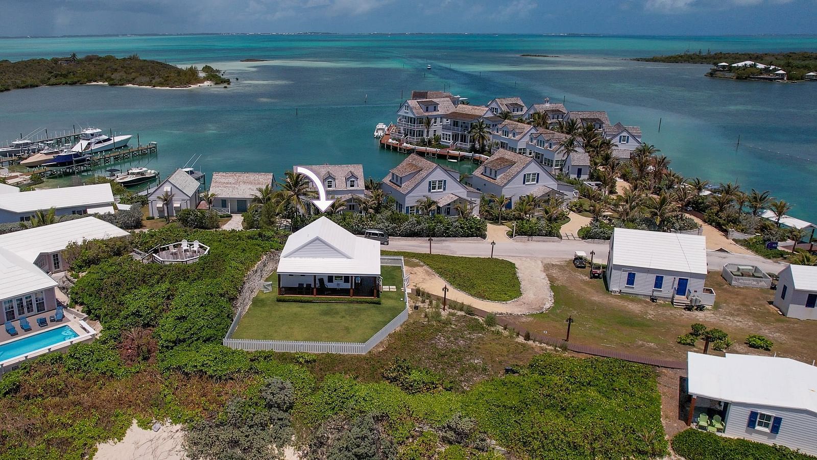 Elevated view of Hill Top Cottage at Abaco Inn facing the water and nearby villas.