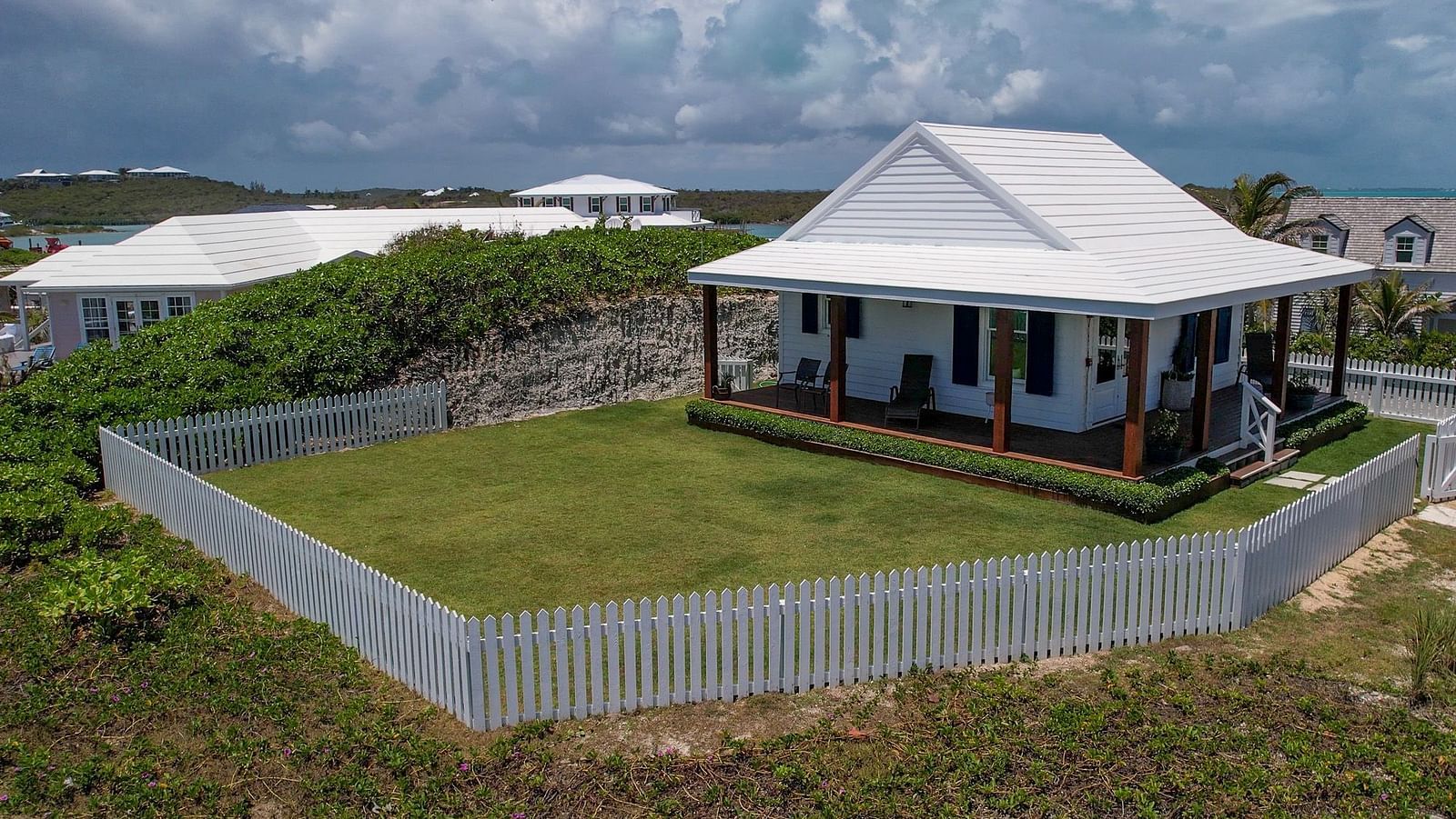 Hill Top Cottage at Abaco Inn with a private garden and fenced boundary.