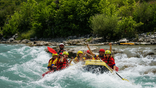 a group of people River Rafting