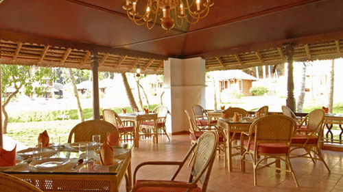 Seating arrangements inside the restaurant - Abad Harmonia, Kovalam