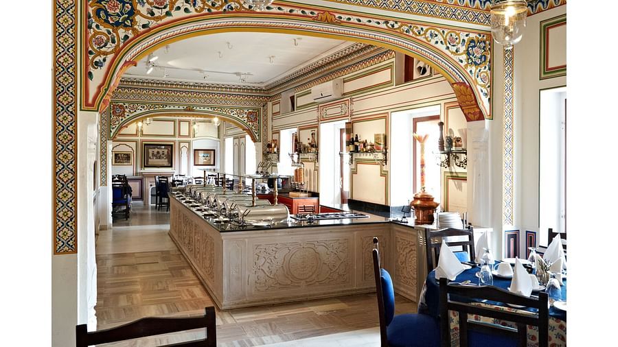 Sileh Khanna Coffee Shop n Bar with blue covers and tables and chairs  - Hotel Castle Mandawar, Jhunjunu