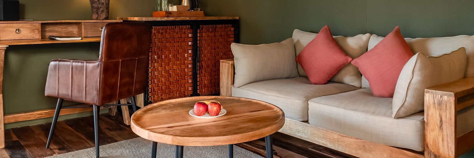 A sofa and a small tea table at Trees N Tigers, Tadoba.