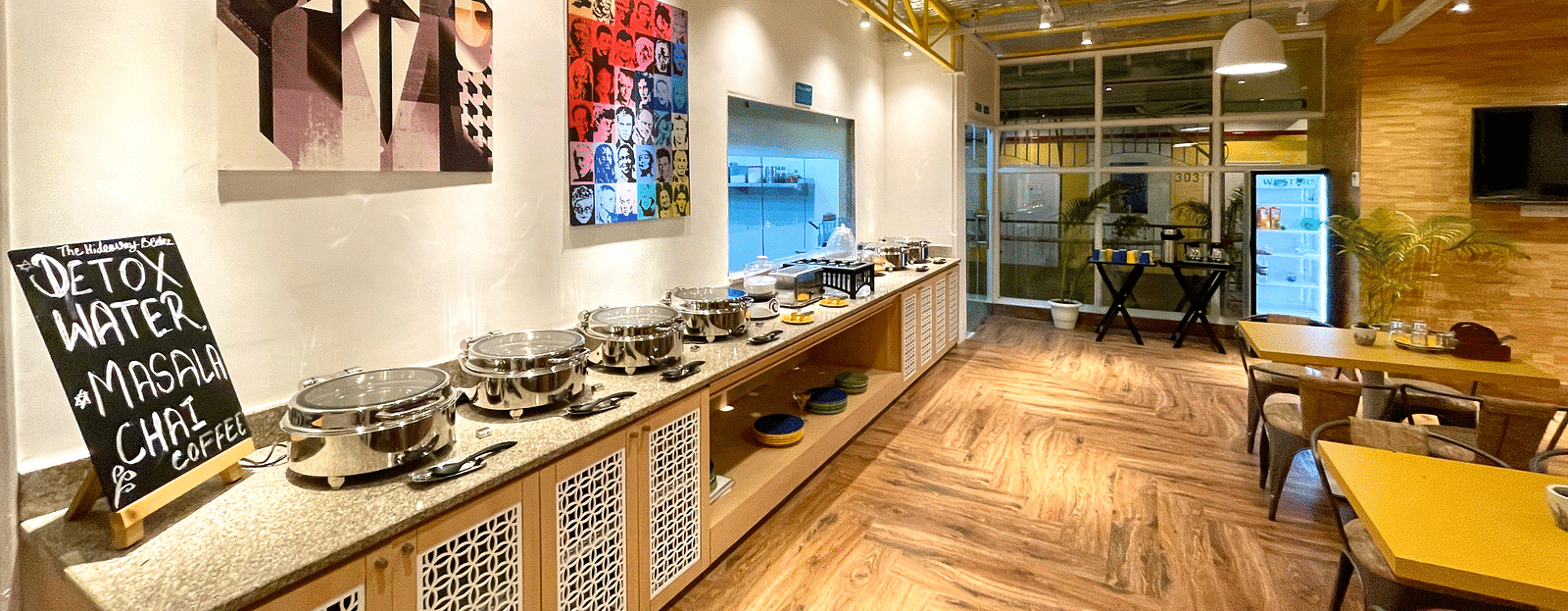 An interior Buffet Counter with seating and wooden flooring