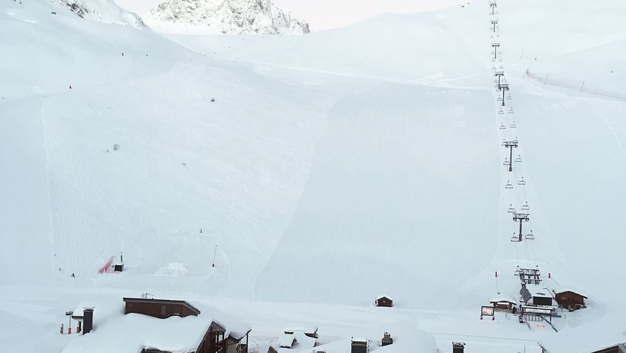 houses in the middle of a snowy mountain