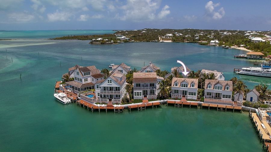 luxurious waterfront houses with private docs, and boats docked nearby at Abaco Inn.