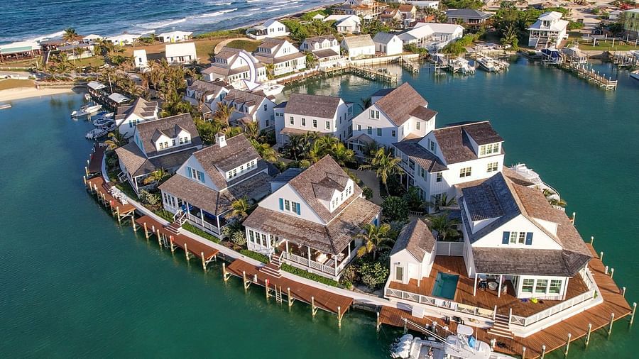 luxurious waterfront houses with private docs, and boats docked nearby at Abaco Inn.