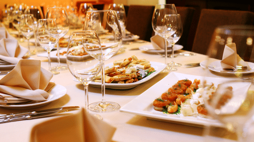A table with snacks and wine glasses