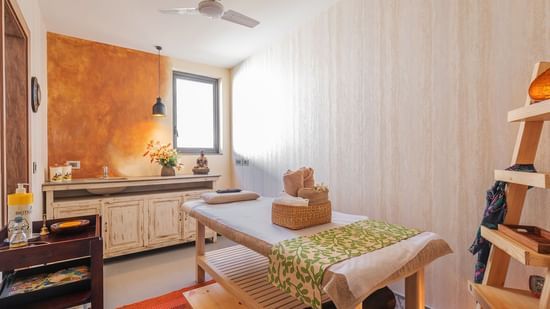 A spa room featuring all the necessary items required for a session or treatment - Karma Lakelands.
