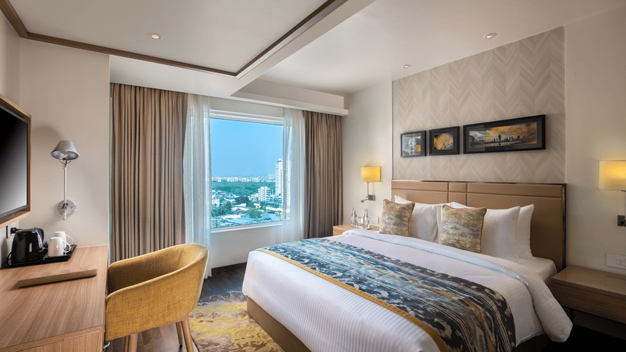 Stylish suite interior at Royal Hometel Suites, Dahisar, Mumbai featuring modern furniture and bright natural light.