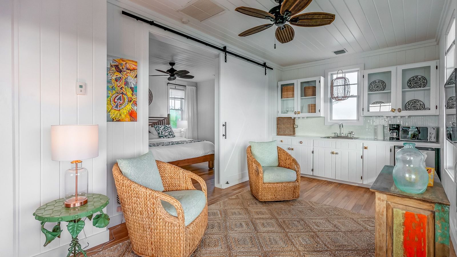 Interior of Hill Top Cottage at Abaco Inn showing a cosy seating area and open-plan layout.