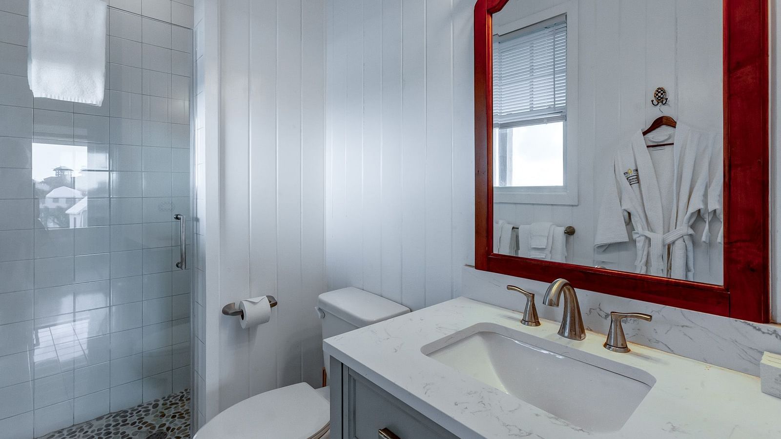 Bathroom view inside Hill Top Cottage at Abaco Inn with modern sink and walk-in shower.