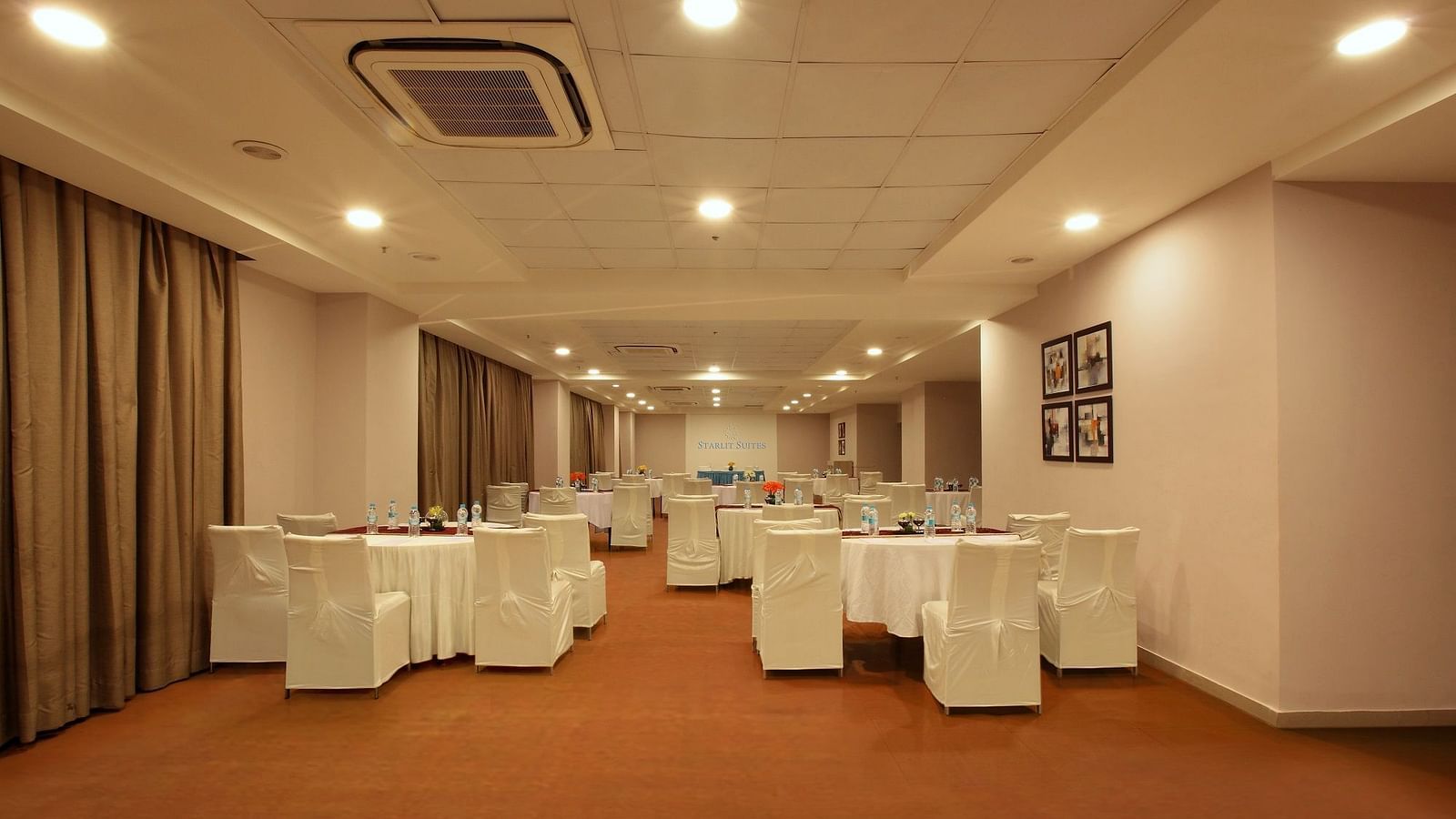 Seating arrangement in the banquet hall at Starlit Suites, Bangalore