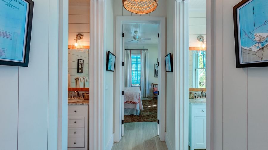 Hallway with hanging wicker light fixtures | Abaco Inn