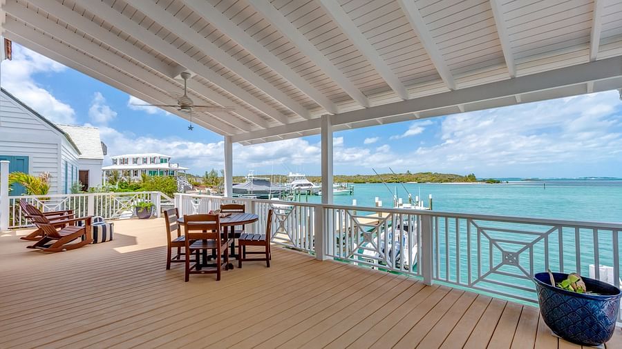 Outdoor deck with seating overlooking turquoise waters | Abaco Inn