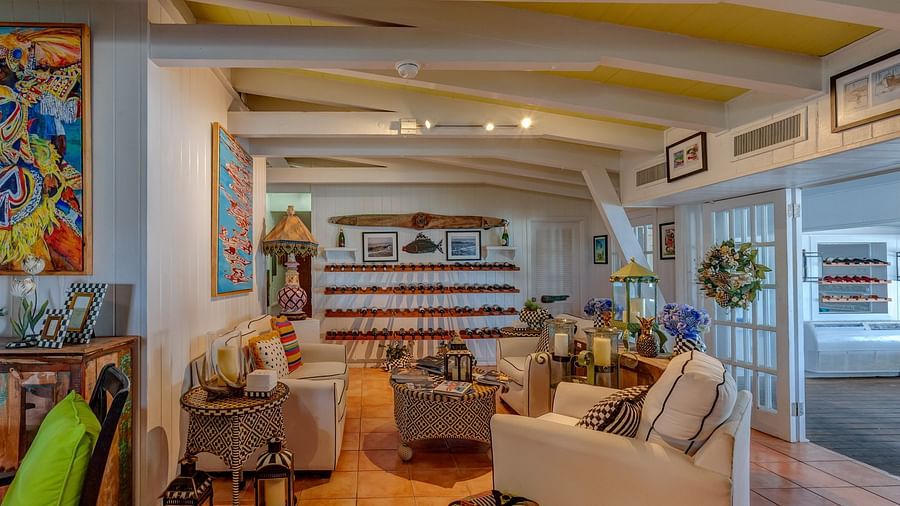  A cozy area with plush sofas, colorful accents, and natural lighting, creating a warm and welcoming retreat | Abaco Inn