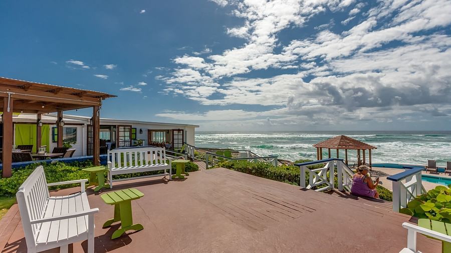 Brick-paved area with oceanfront view and patio seating | Abaco Inn
