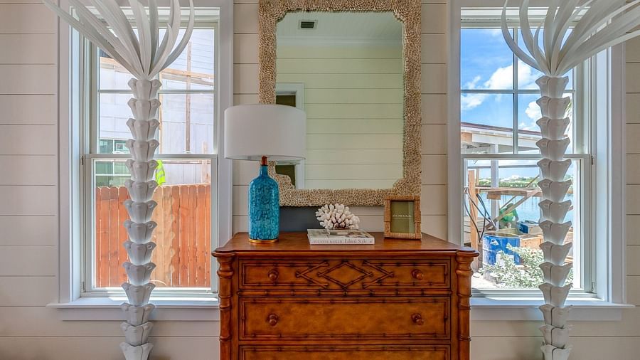 Reading nook with a wooden dresser and a large window | Abaco Inn