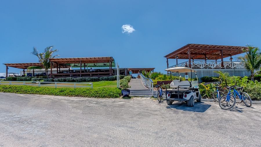 Open gravel area with buildings in the background | Abaco Inn