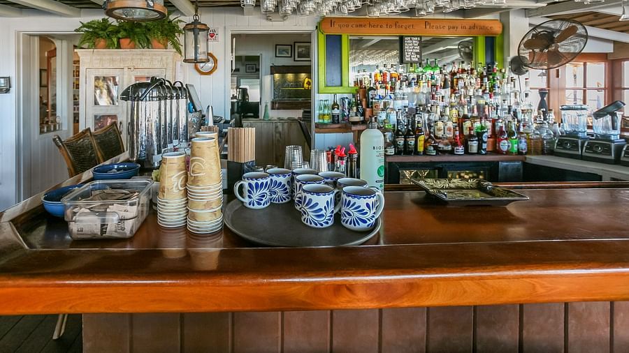 Bar counter with drinks and glassware | Abaco Inn