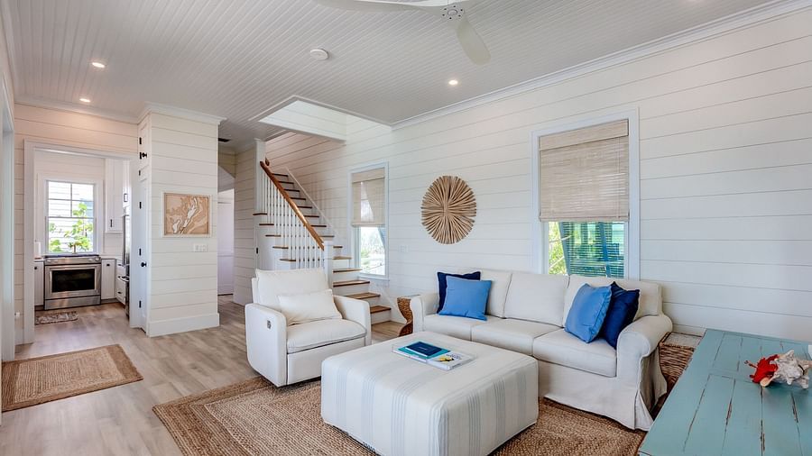 Spacious living area with white sofas and coastal decor | Abaco Inn