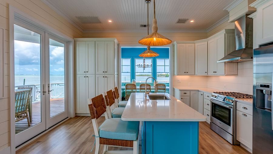 Open kitchen and dining area with ocean views and wooden accents | Abaco Inn