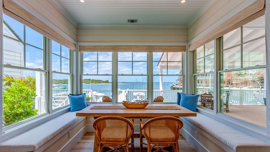Window-side dining nook with a view of the water | Abaco Inn