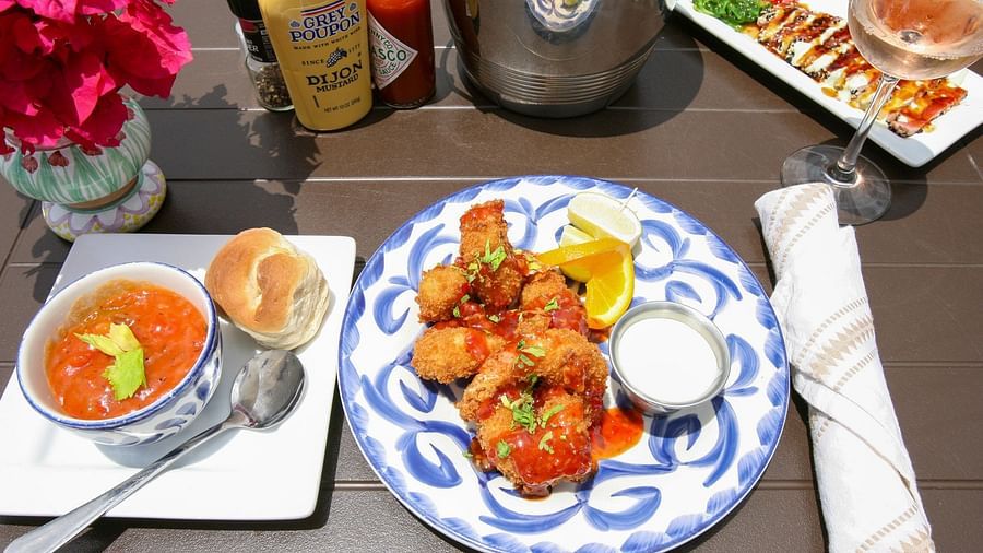 Breakfast plate with fruits, eggs, and seafood on a table | Abaco Inn