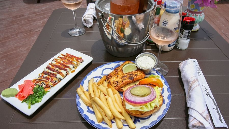 Lunch plate with fries, burger, and salad on a restaurant table | Abaco Inn