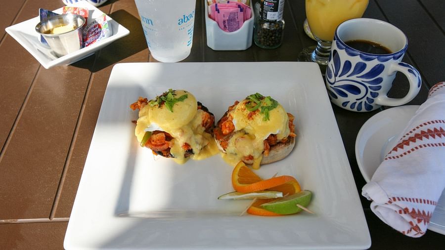 Breakfast with stuffed crepes, coffee, and juice on a table | Abaco Inn