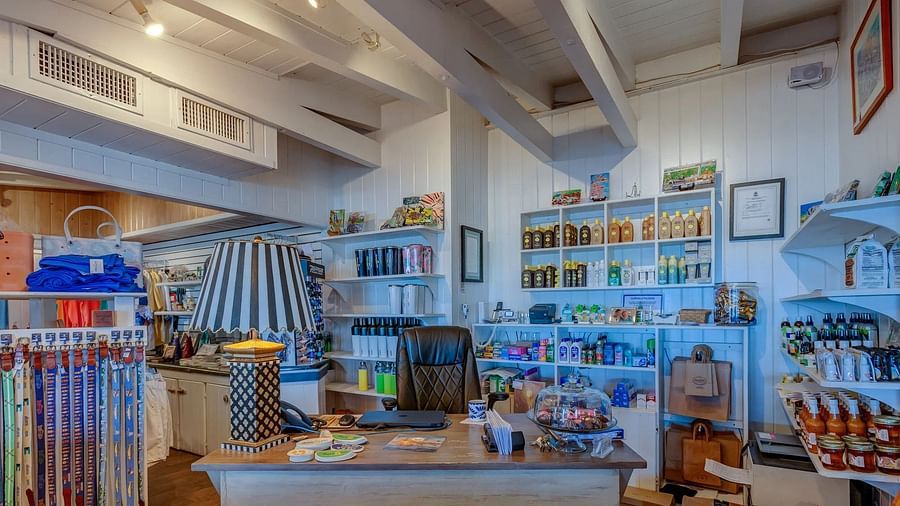 Retail space showing a large selection of casual clothing and beachwear items arranged in sections throughout the store.