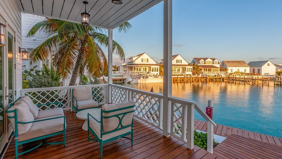 a sitting area with chairs and wooden floor featuring the sea view at Abaco Inn.