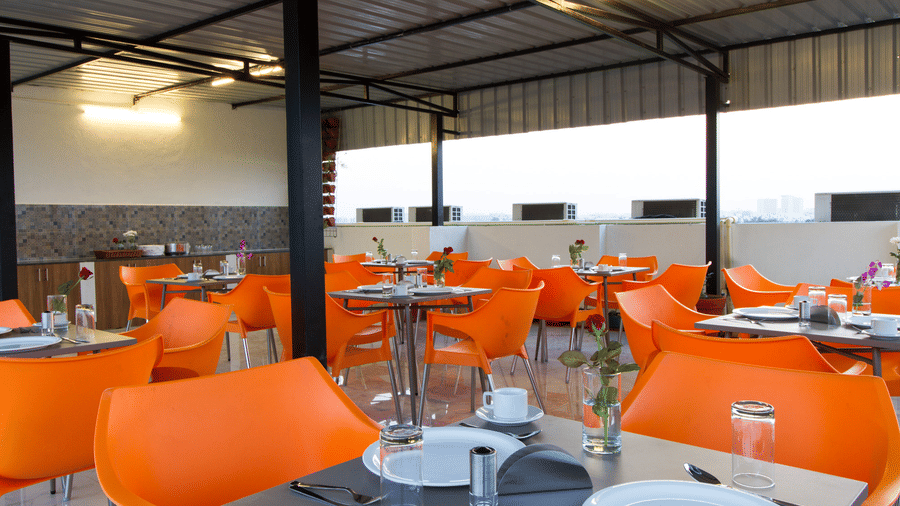 Elegantly set indoor restaurant dining area at Sanctum Suites Whitefield, Bangalore.
