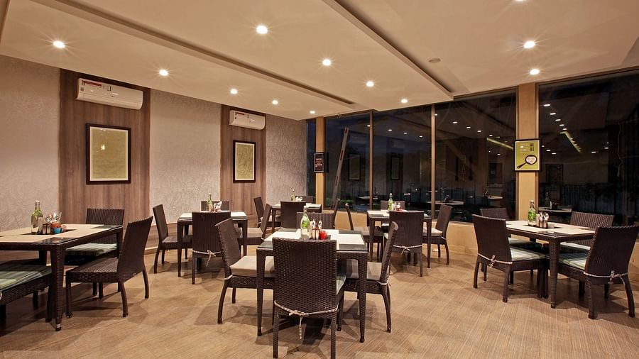 Seating in the restaurant at Starlit Suites, Bangalore