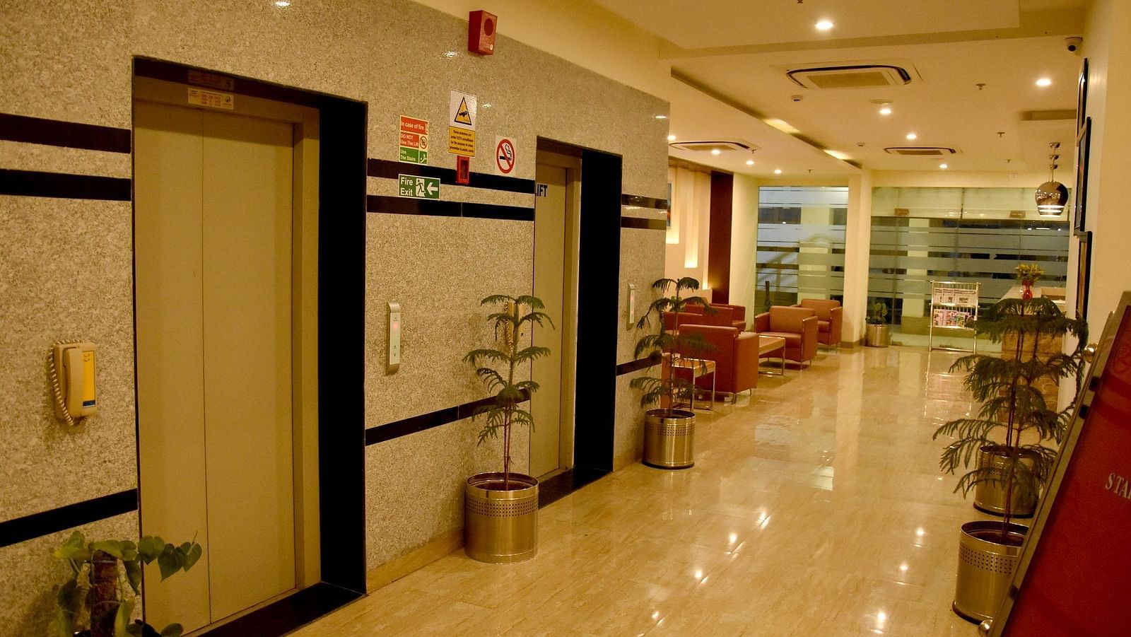 Lift view with potted plants next to it - Starlit Suites, Neemrana