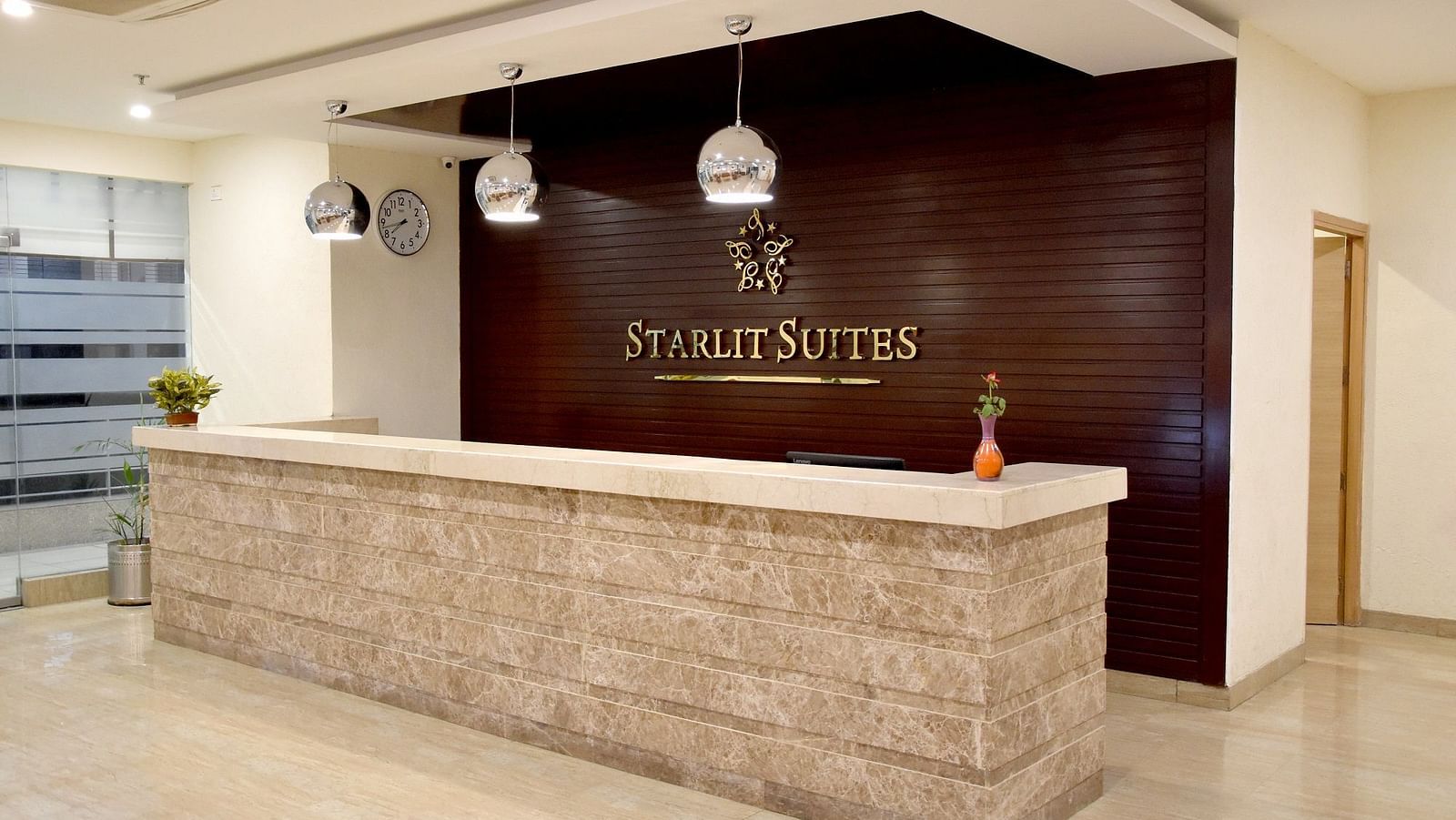 Reception view of Starlit Suites, Neemrana with lights above the desk